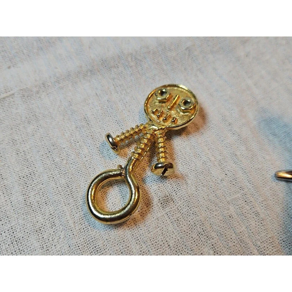 Unbranded Jewelry - Vintage Hook Loop Bolts And Screws Gold Toned Man brooch